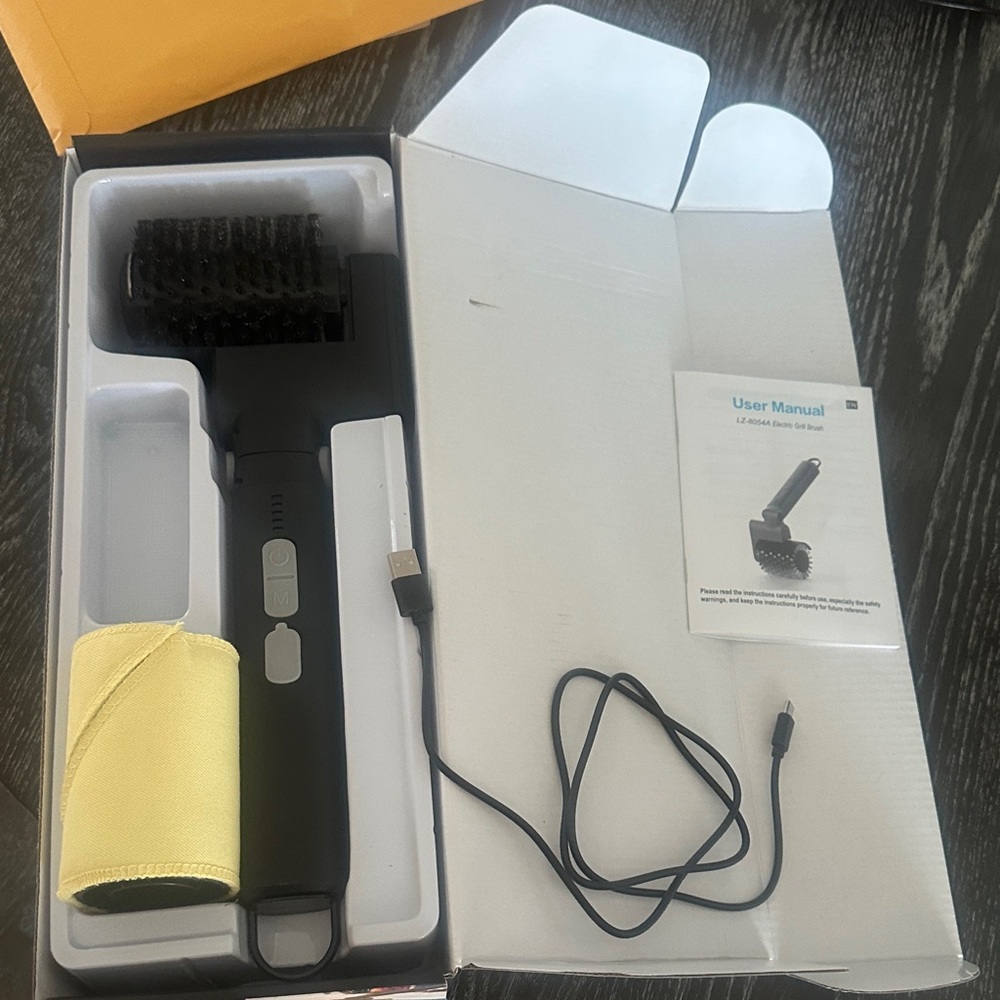 Black rechargeable Cordless BBQ Grill Brush with Yellow Cloth